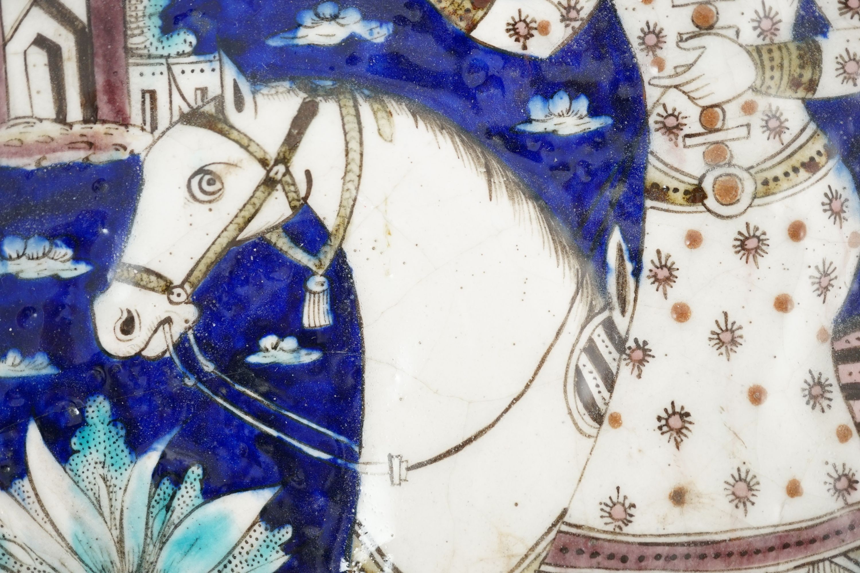 A Persian polychrome tile, Qajar dynasty - 34.5 x 27cm 34 cm x 27.5 cm